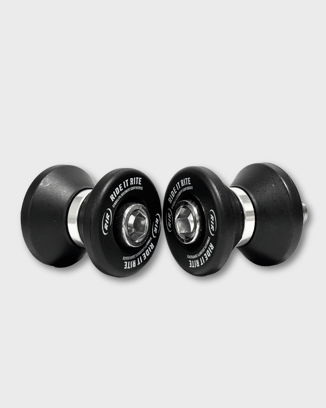 A set of black and silver Ride It Rite swingarm spools on a light grey background