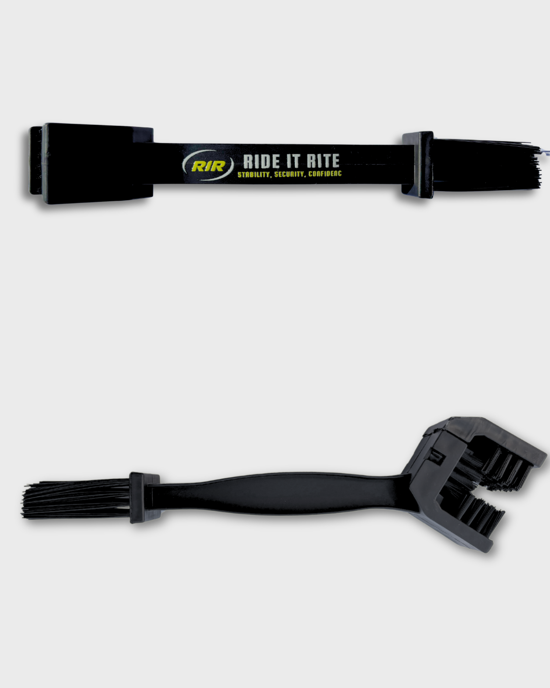 Two black  motorcycle chain cleaning brushes from Ride It Rite shown on a light gray background, one positioned horizontally at the top and the other vertically at the bottom.