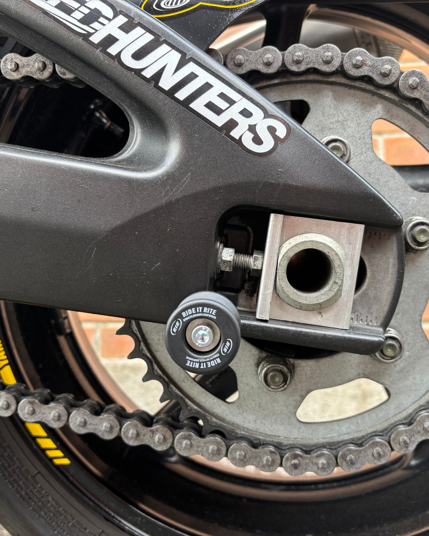 Close up of a Ride it Rite swing-arm spool on a motorbike